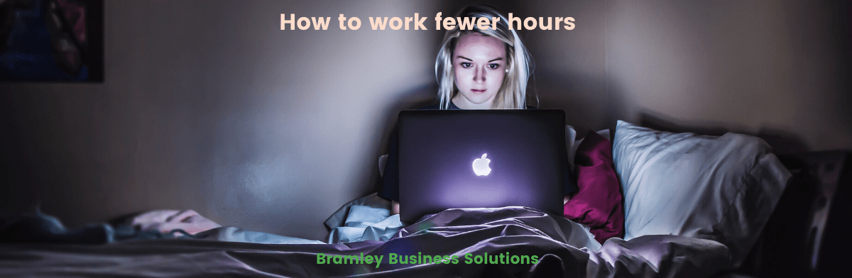 banner image for blog "how to work fewer hours" by Bramley Business Solutions, showing a woman sitting in the dark working on a laptop