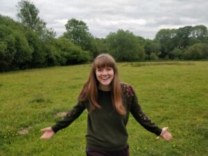 Emma Langridge standing in the beautiful Kent countryside, providing small business support in Kent