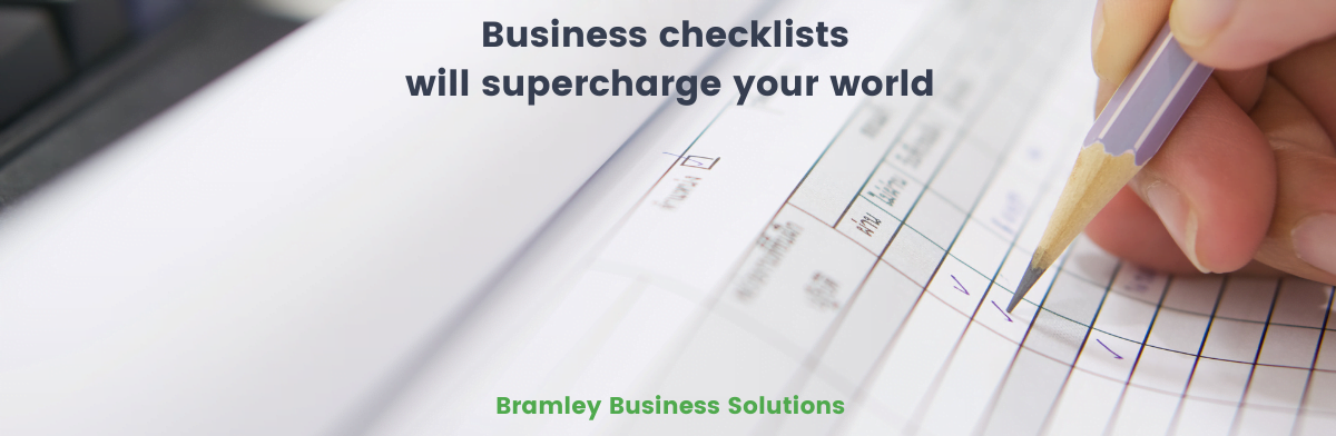 picture of a business checklist in use, with blog title 'business checklists will supercharge your world' over the top